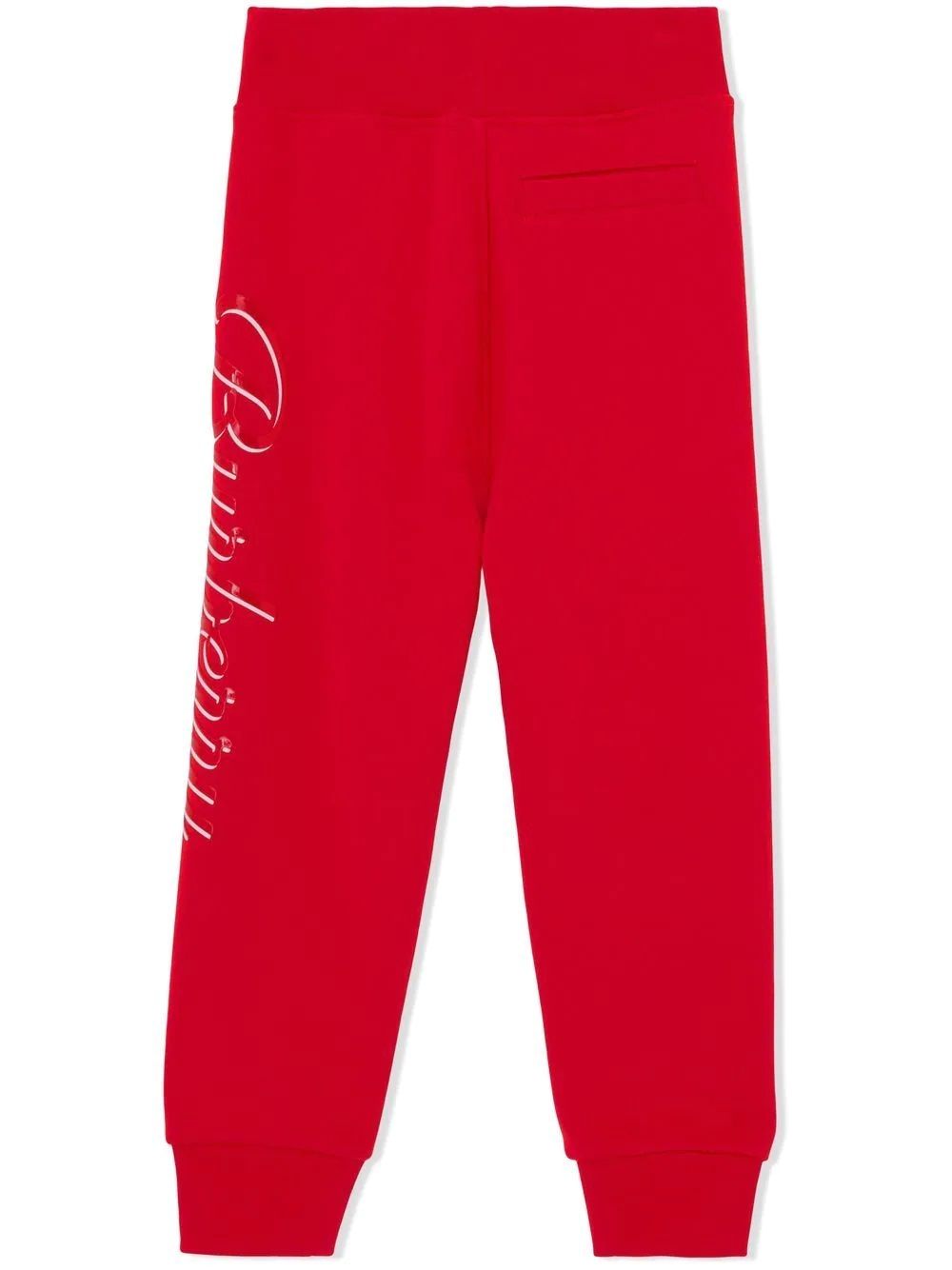 Burberry Kids: Logo Print Pants in Bright Red Get your little boy ready in style with Burberry Kids' Logo Print Pants in Bright Red. Made with 100% cotton, featuring an elasticated waistband and ankles for maximum comfort.