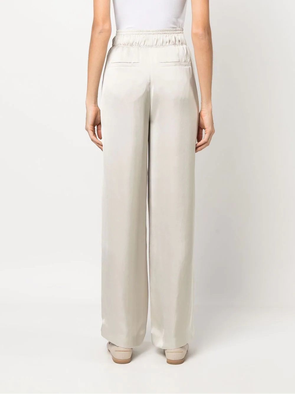 Women's Ivory Wide Leg Brunello Cucinelli Trousers Women's ivory wide leg trousers by BRUNELLO CUCINELLI. Elasticated waistband, pockets. 100% polyester.