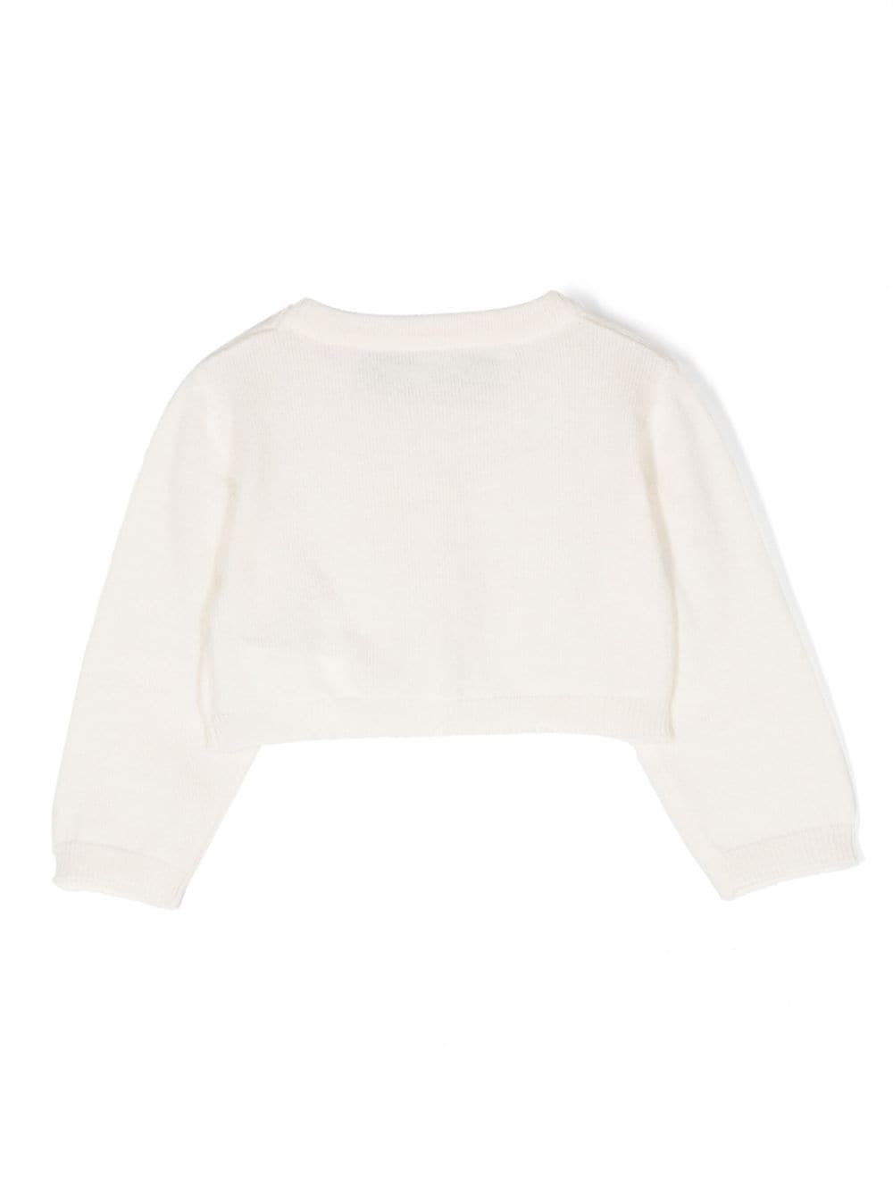 Cardigan a maglia SIMONETTA KIDS Tenetela al caldo con stile con questo cardigan a maglia per bambini di SIMONETTA KIDS. Perfetto per ogni occasione.