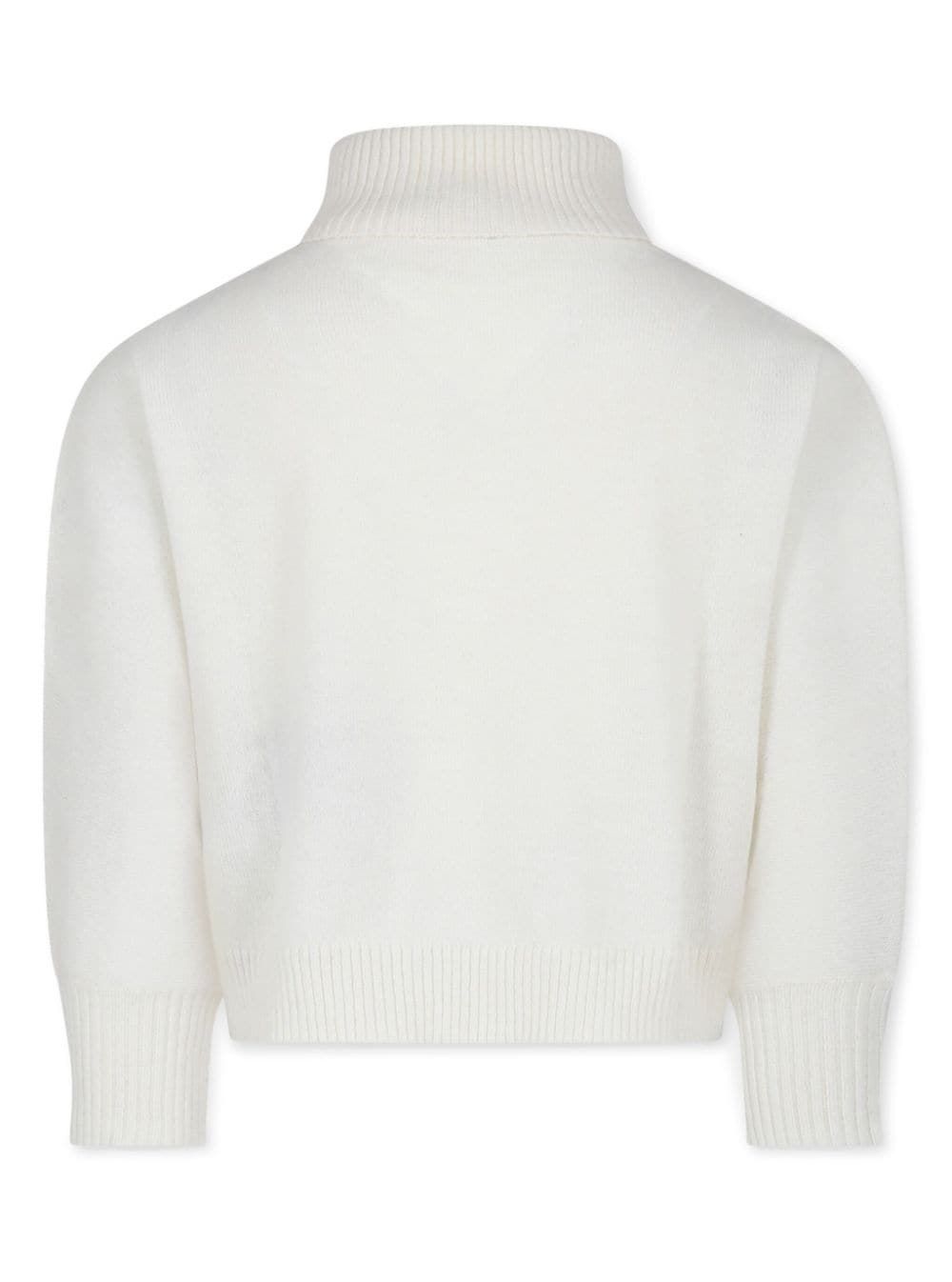 BALMAIN KIDS knitwear Stay stylish this season with our knit top from BALMAIN KIDS. Made with a luxurious blend of wool, metallic, cashmere, and polyamide, this FW24 collection piece is perfect for any fashion-forward girl.