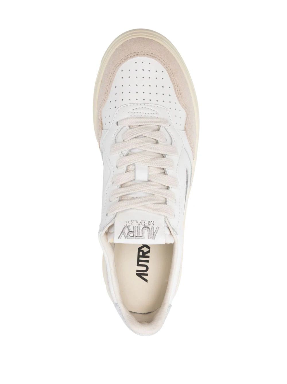Autry Medalist Low Sneakers da donna Aggiorna il tuo gioco di sneaker con le Autry FW24 Medalist Low in pelle premium per donne. 70% pelle di mucca, 20% camoscio, 10% nylon. Acquista ora!