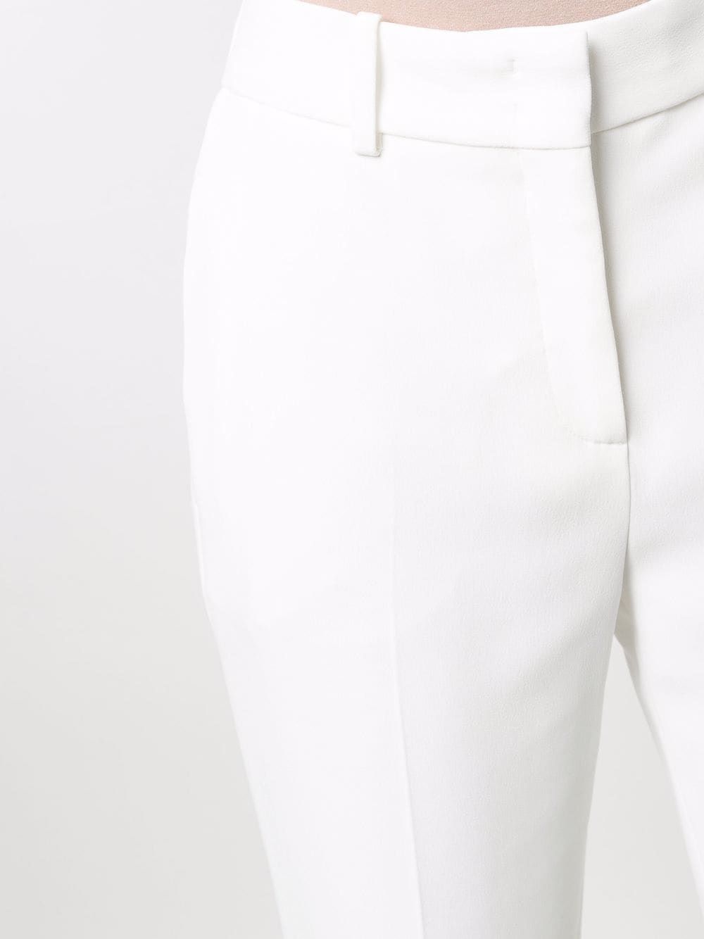 Women's White Slim-Fit Trousers by Ermanno Scervino Slim-fit trousers in white for women by Ermanno Scervino. 51% AC, 49% VI.