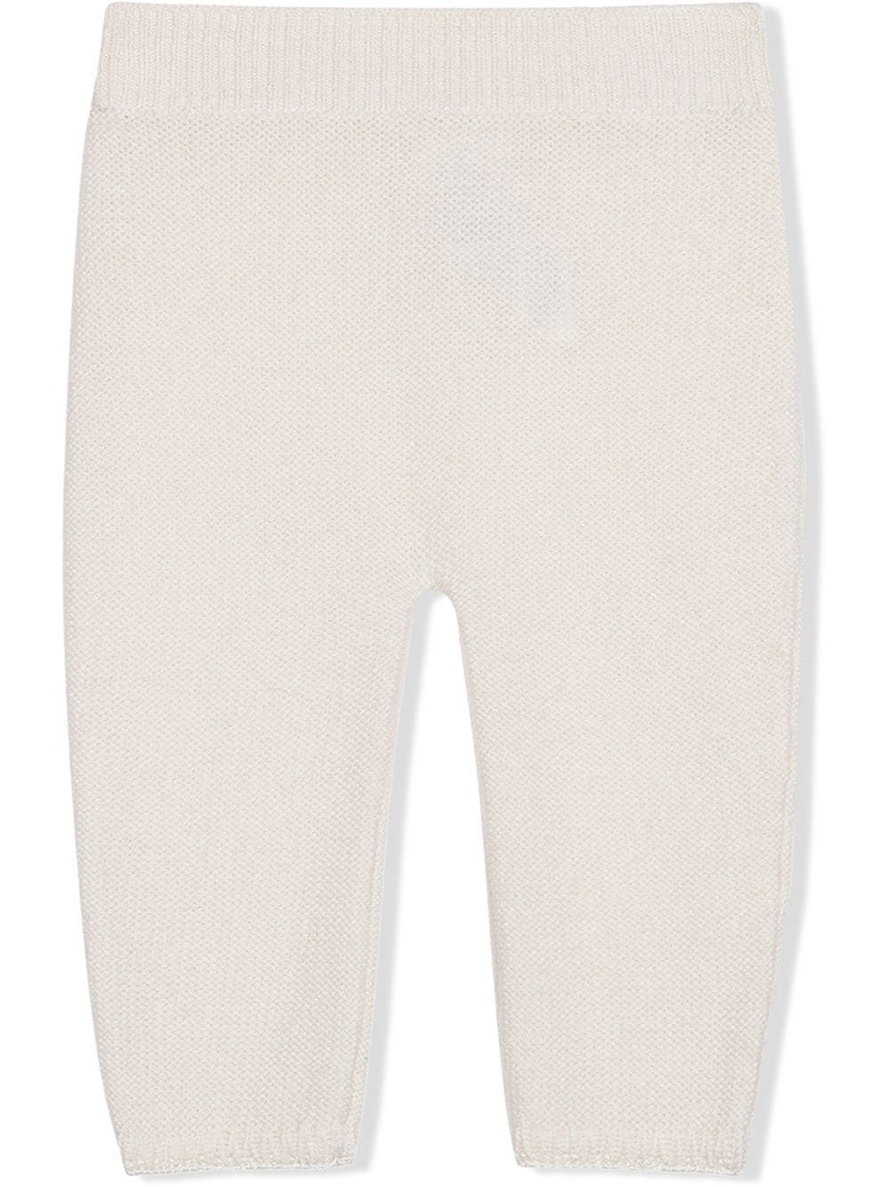 D&G Kids White Trousers  Shop stylish white trousers for kids by Dolce & Gabbana KIDS. Knitted design, ribbed detail & slim cut. 100% WS.