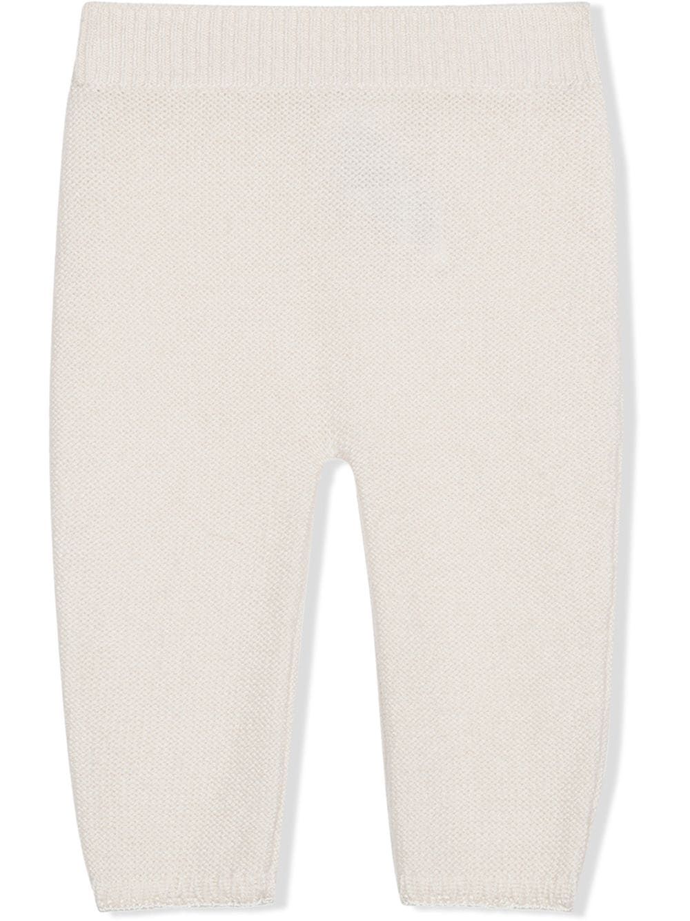 D&G Kids White Trousers  Shop stylish white trousers for kids by Dolce & Gabbana KIDS. Knitted design, ribbed detail & slim cut. 100% WS.