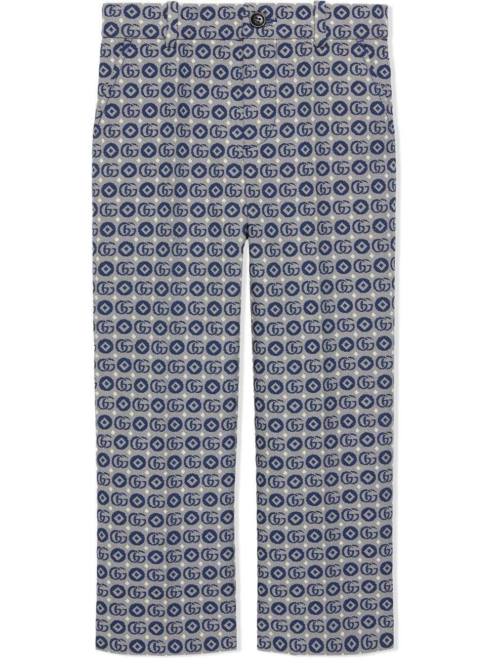 GUCCI KIDS Trousers Upgrade your little one's wardrobe with these stylish GUCCI KIDS trousers in blue/grey. Made with a straight cut and featuring a button closure, passers-by, and two side pockets. Perfect for any occasion. From the CARRY OVER season. 53%CO 47%PL composition.