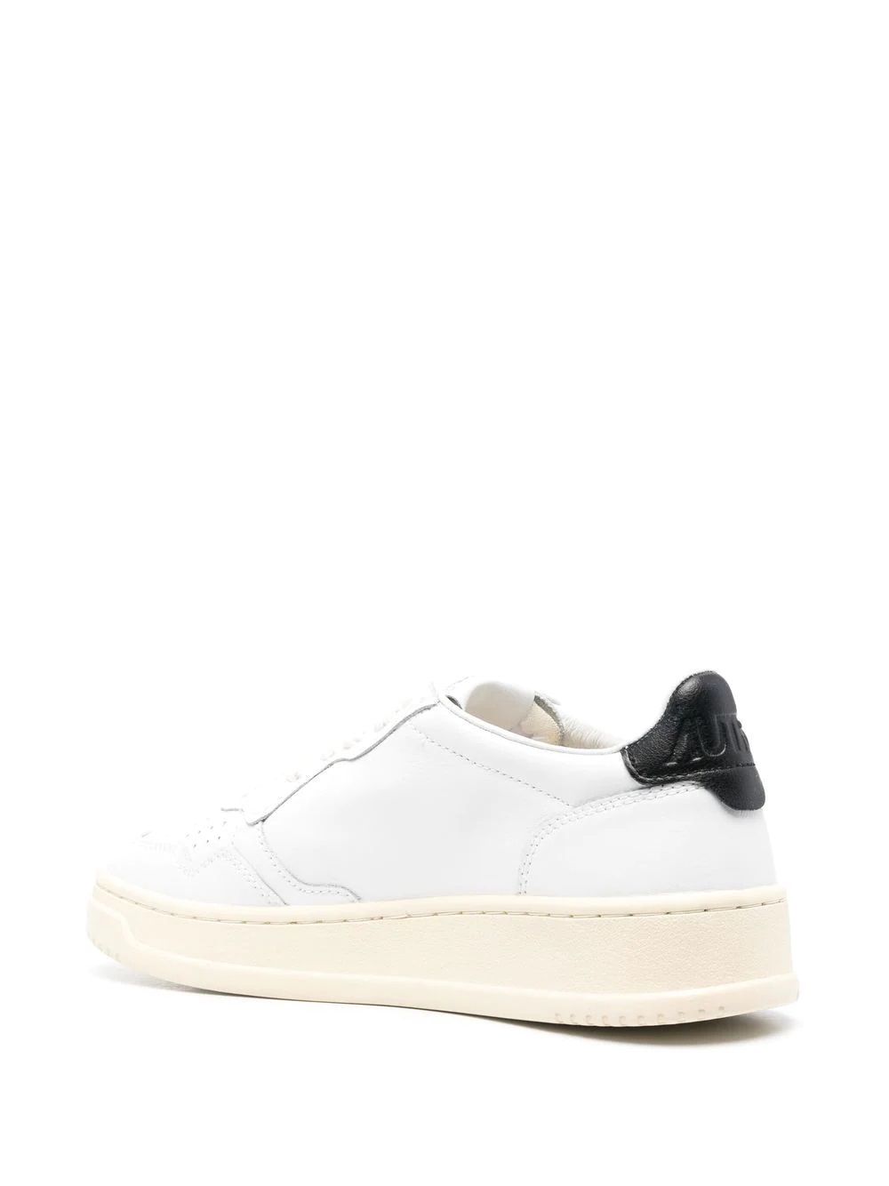 Women's White AUTRY 01 Sneakers Women's White Sneakers: 100% Leather & Rubber by AUTRY. Reinforced heel & logo. Strings.