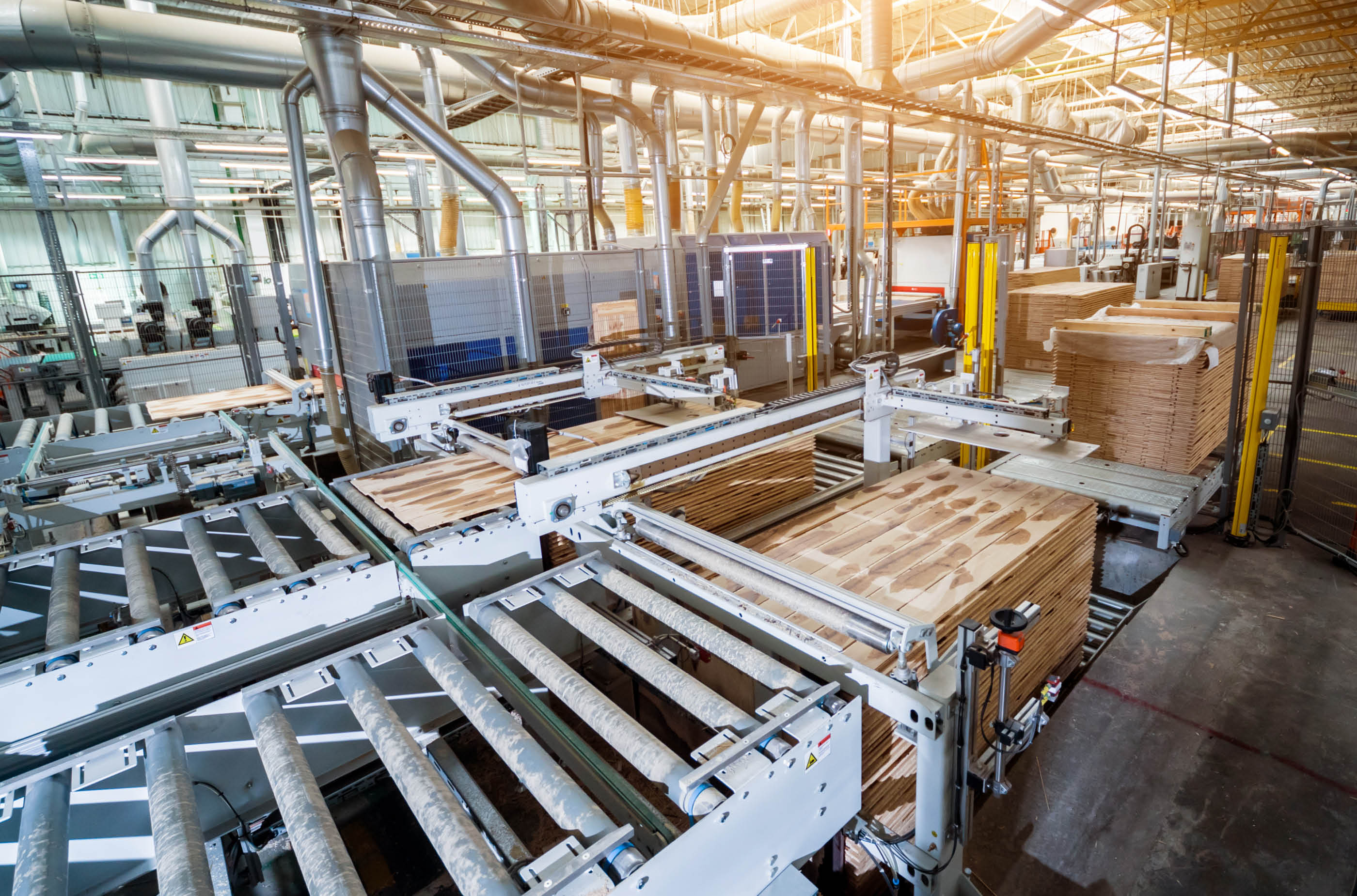 Production line of the wooden floor factory  CNC automatic woodworking machine  Industrial background