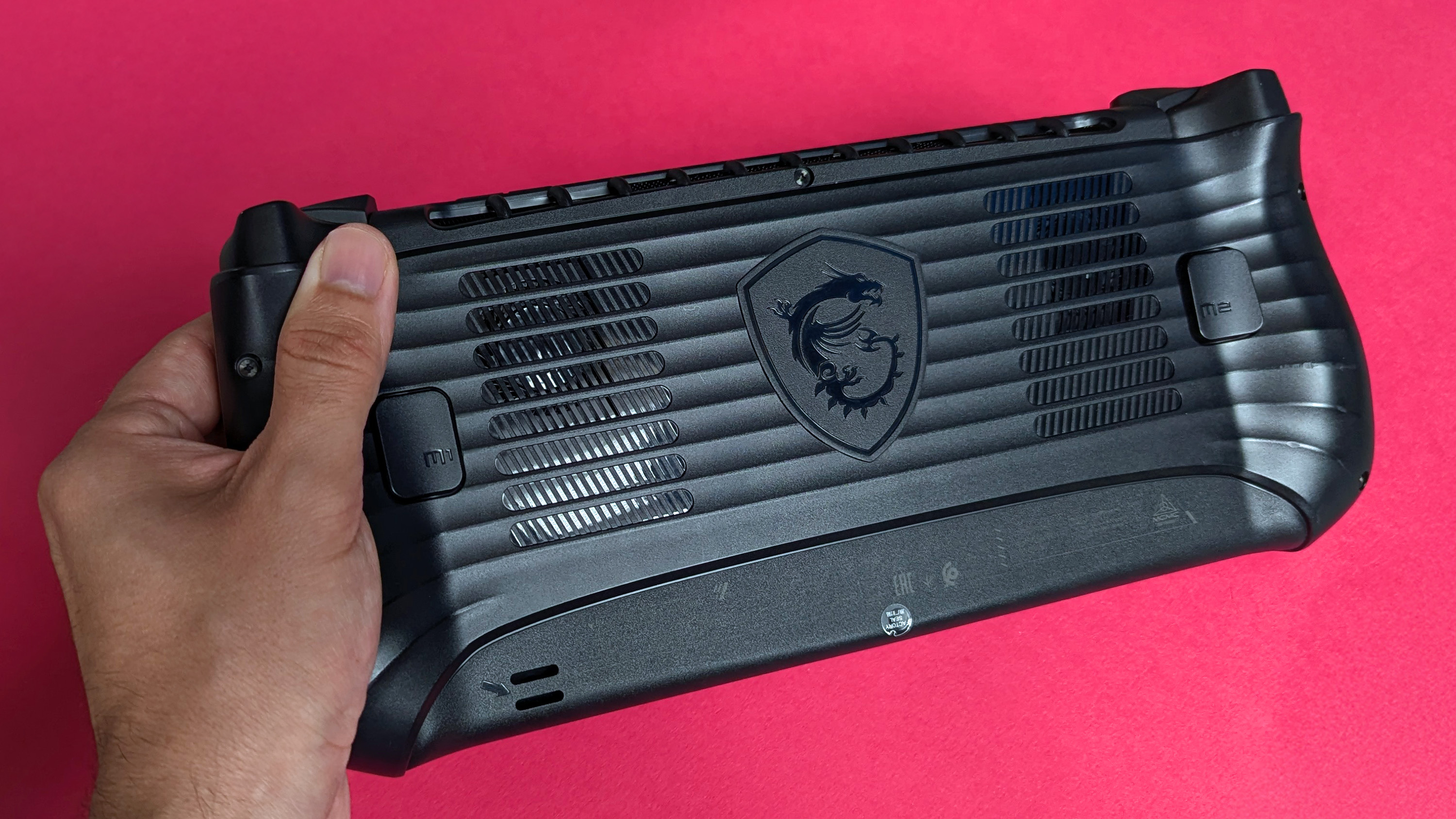 MSI Claw 8 AI+ handheld gaming PC rear view showing cooling system and logo
