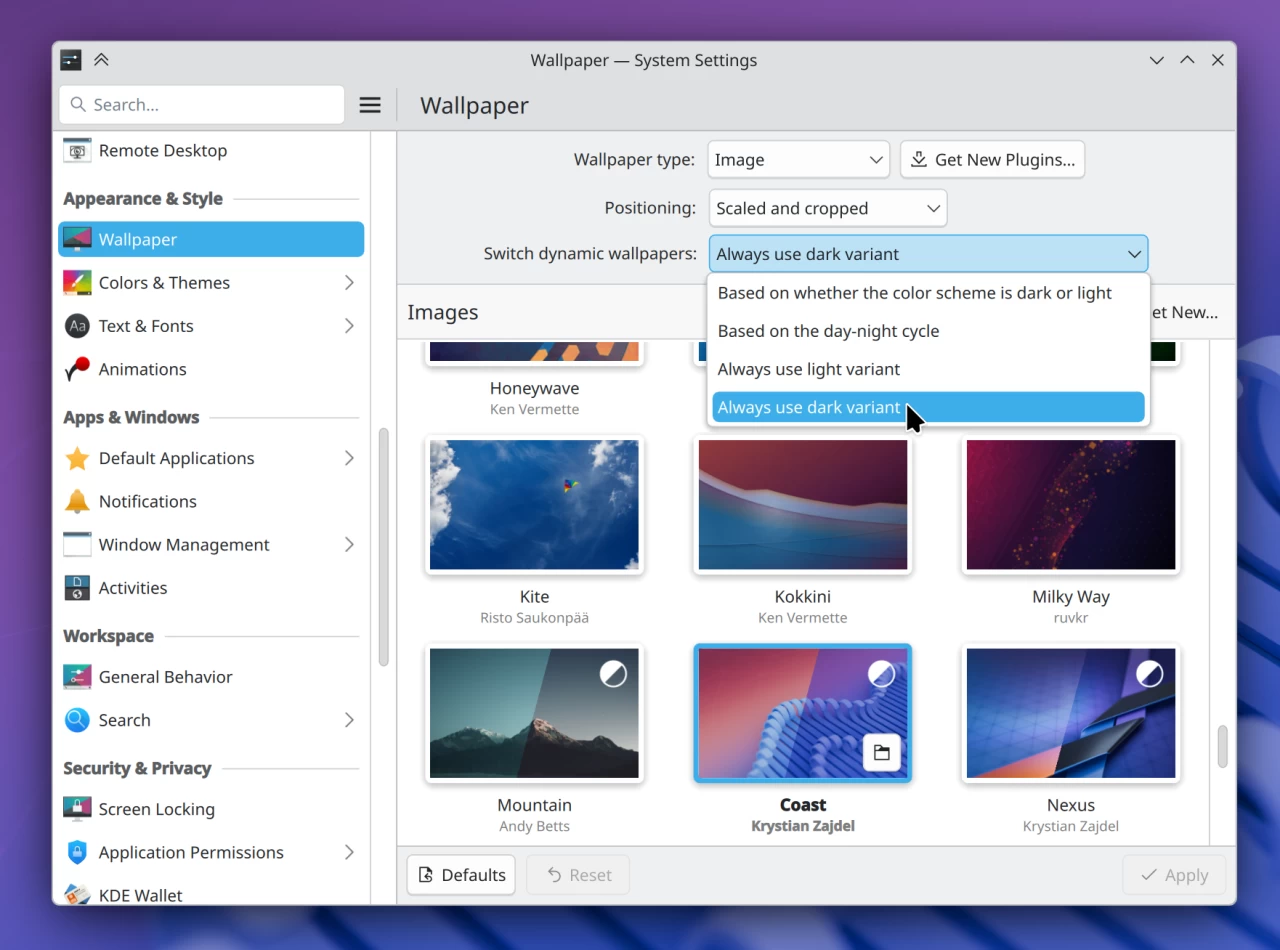 System Settings Wallpaper page showing the ability to register a preference for light or dark wallpapers