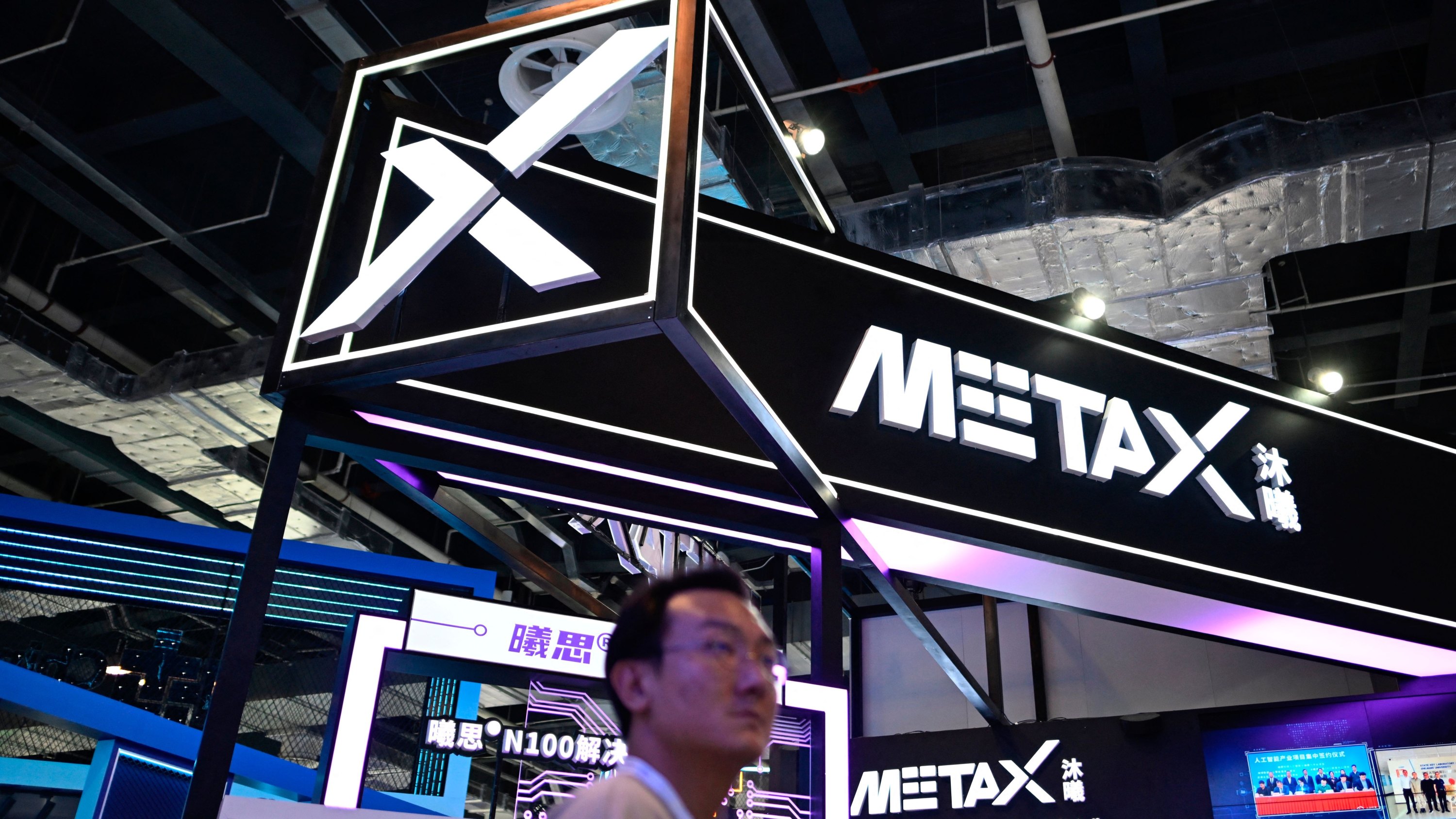 People visit the booth of MetaX during World Artificial Intelligence Conference (WAIC) in Shanghai on July 6, 2023.
