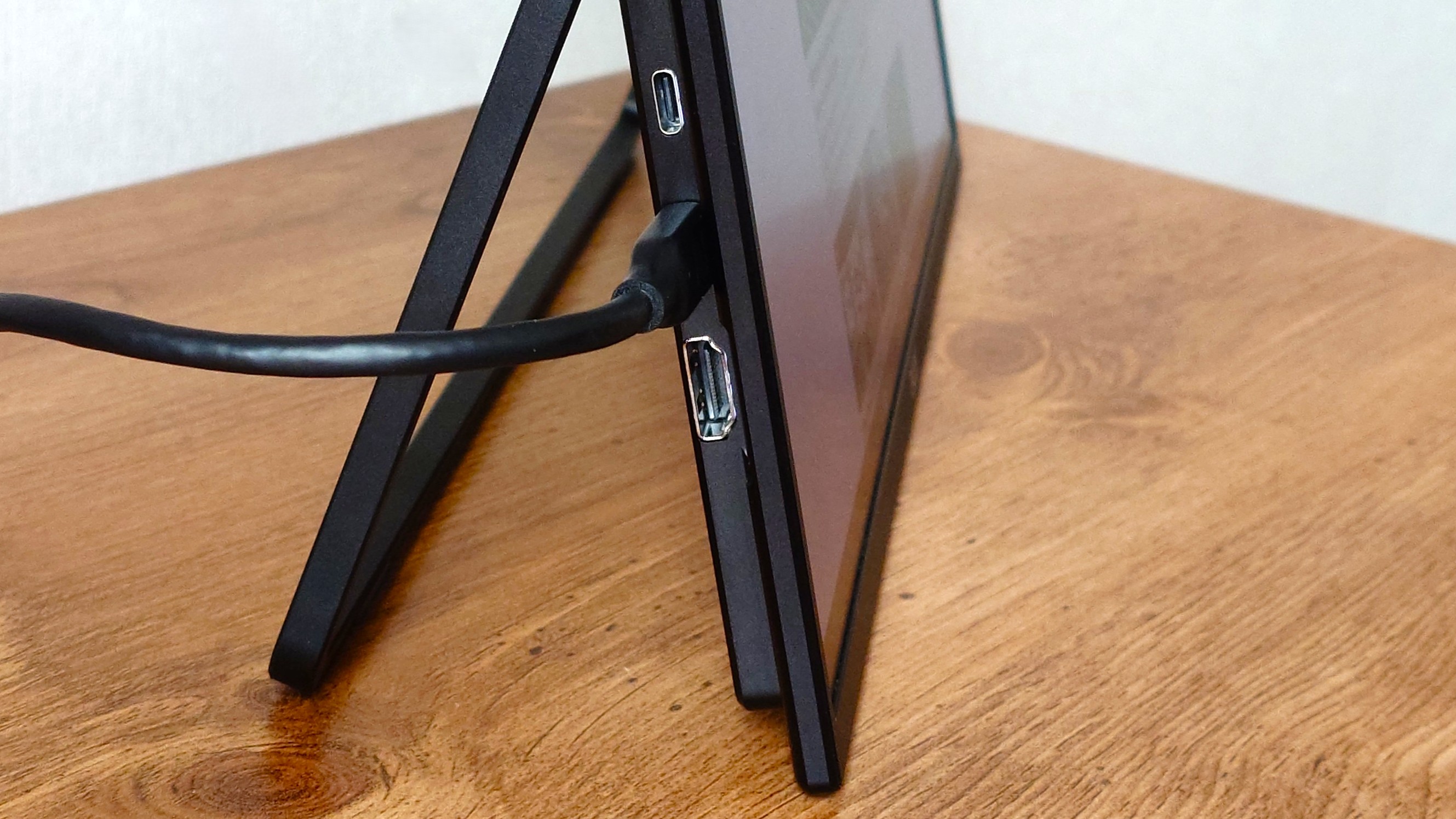 The ports on the Acer dual-screen portable monitor are hidden behind the kickstand when closed.