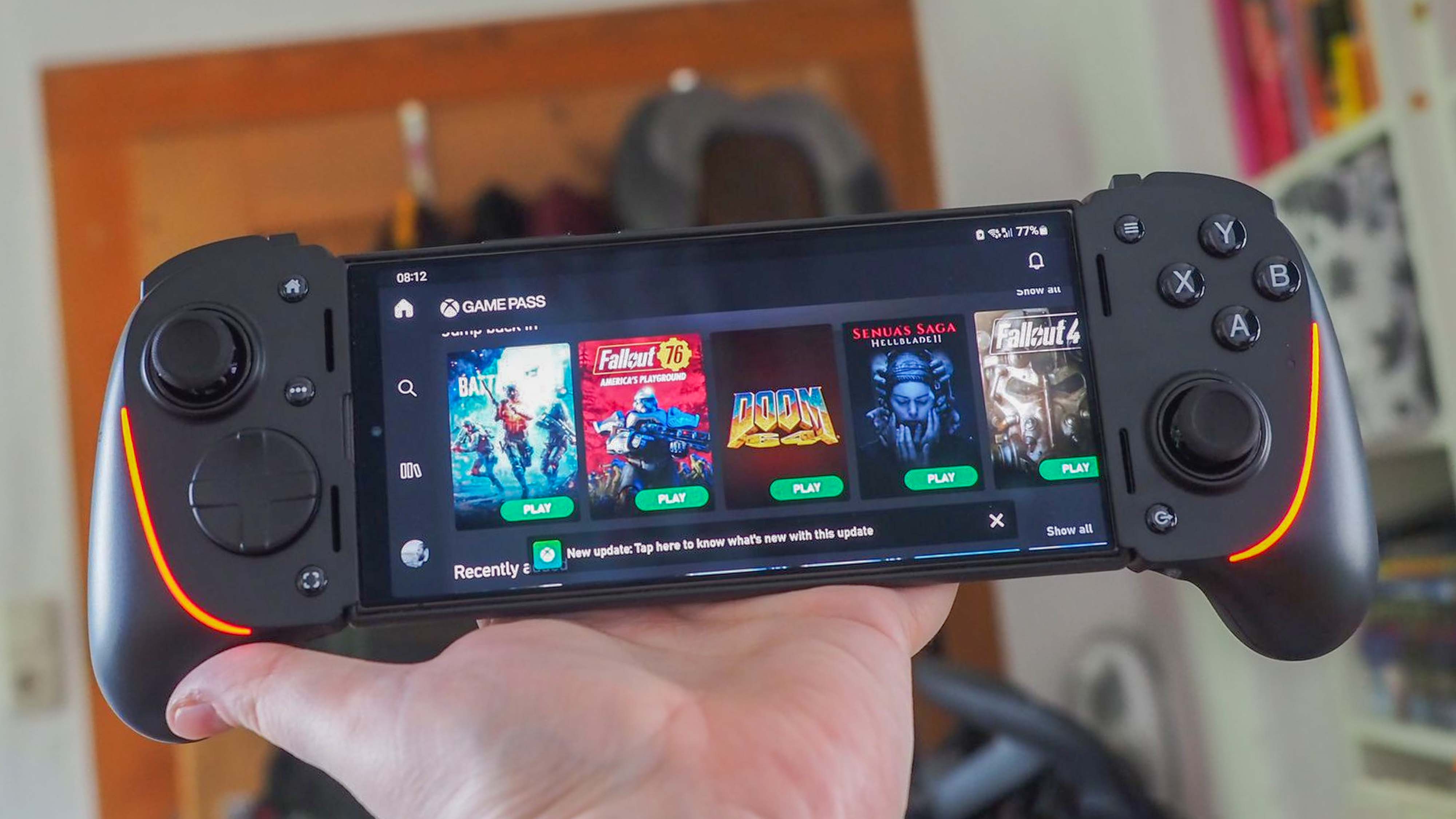 Razer Kishi Ultra being held up in the air.