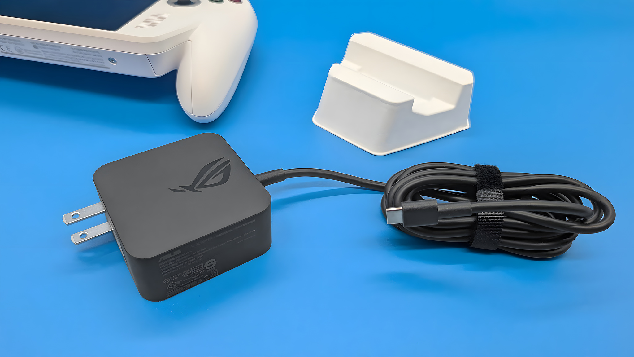 The Xbox Ally's included 65W charger and stand.