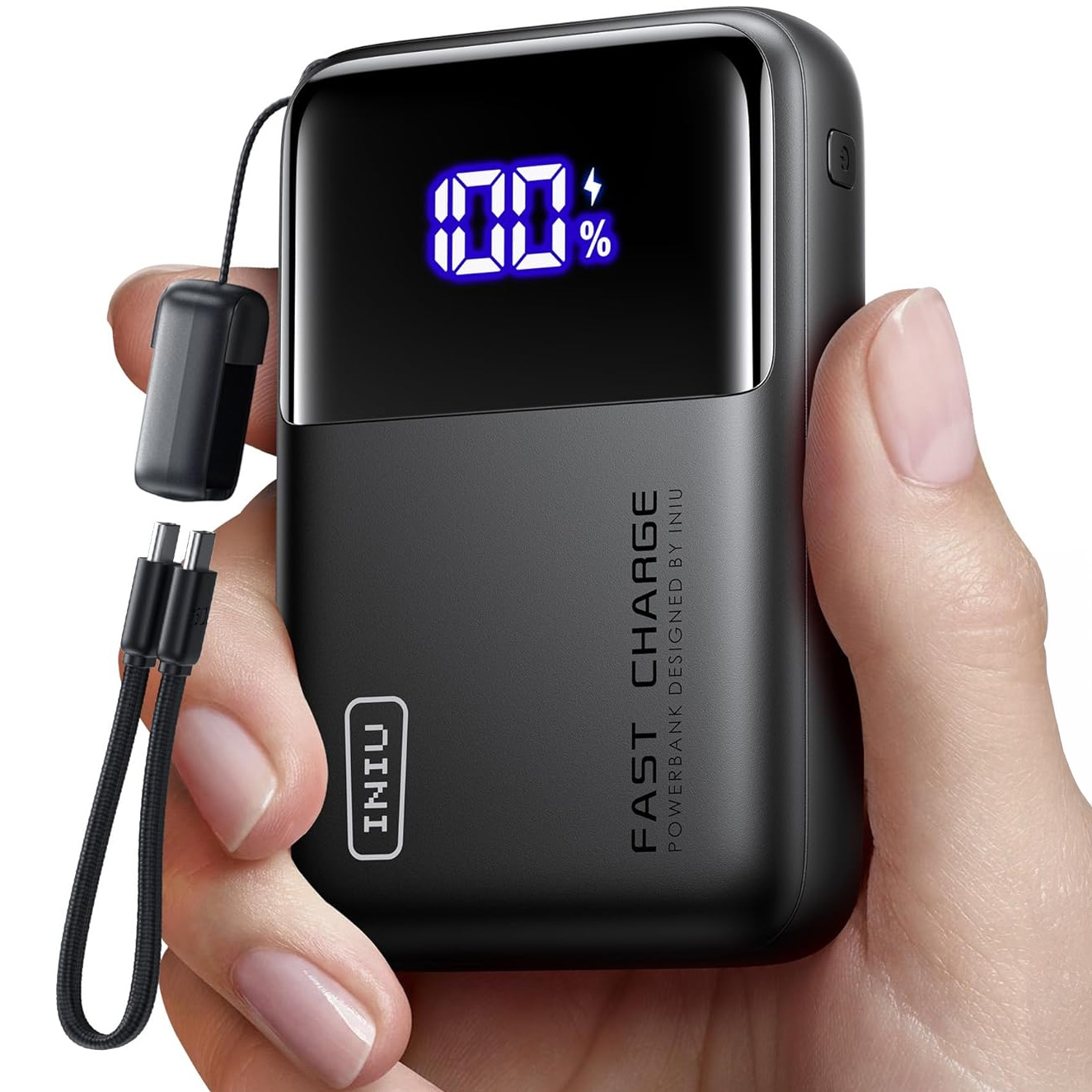 A hand holding the INIU 100W Power Bank Mini.