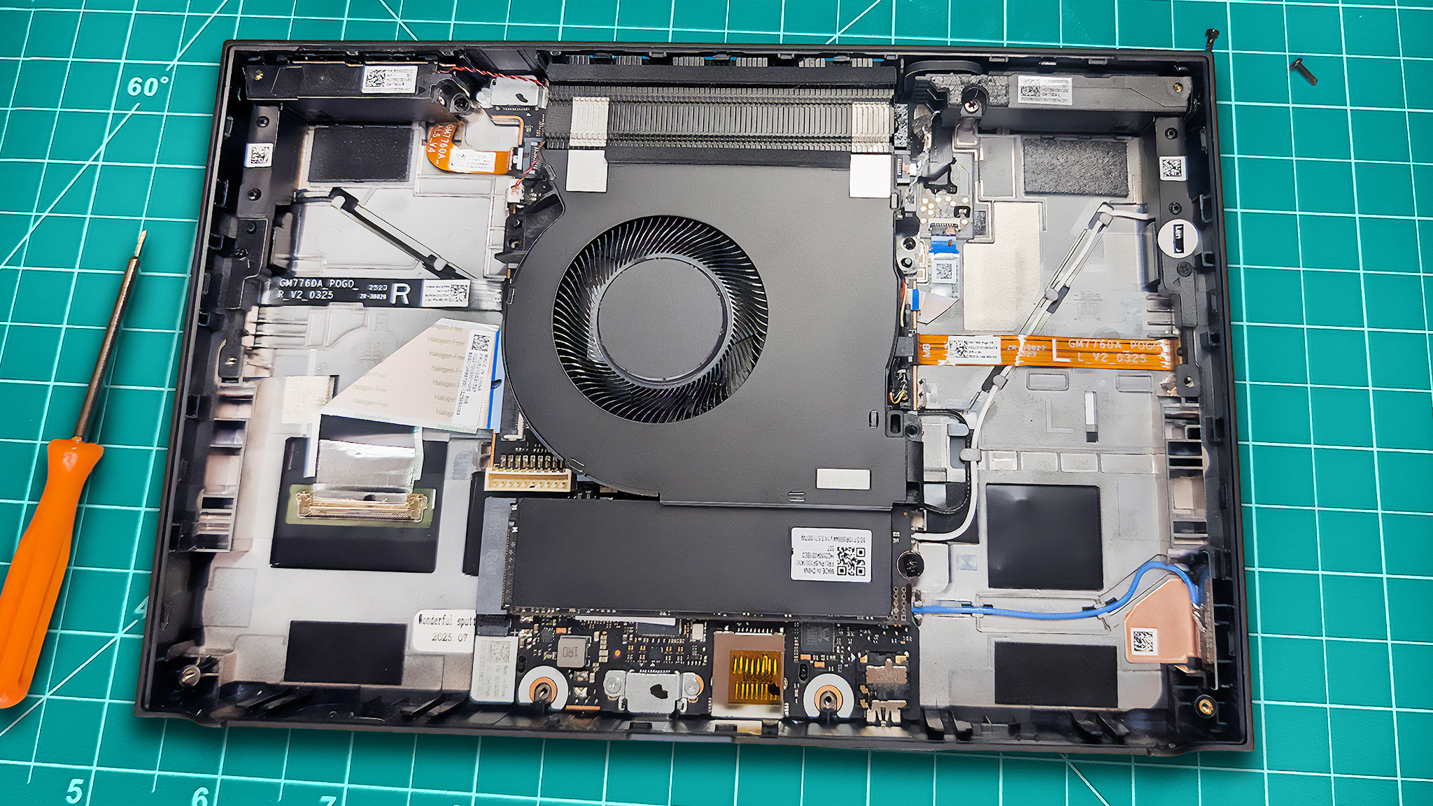 The Lenovo Legion Go 2 opened with the battery removed to make the SSD more visible.