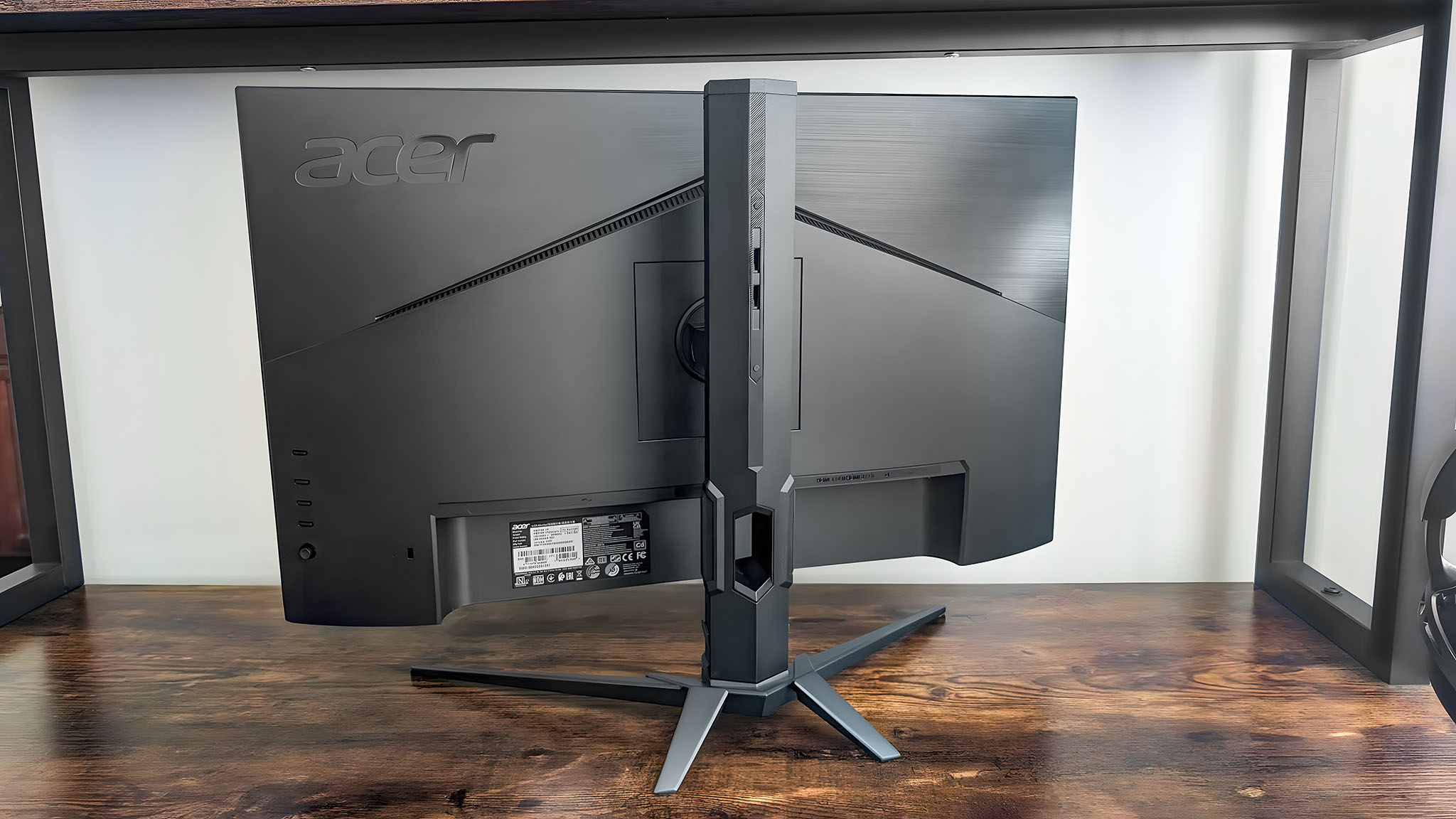 The back of an Acer Predator XB273K as it sits on a desk.