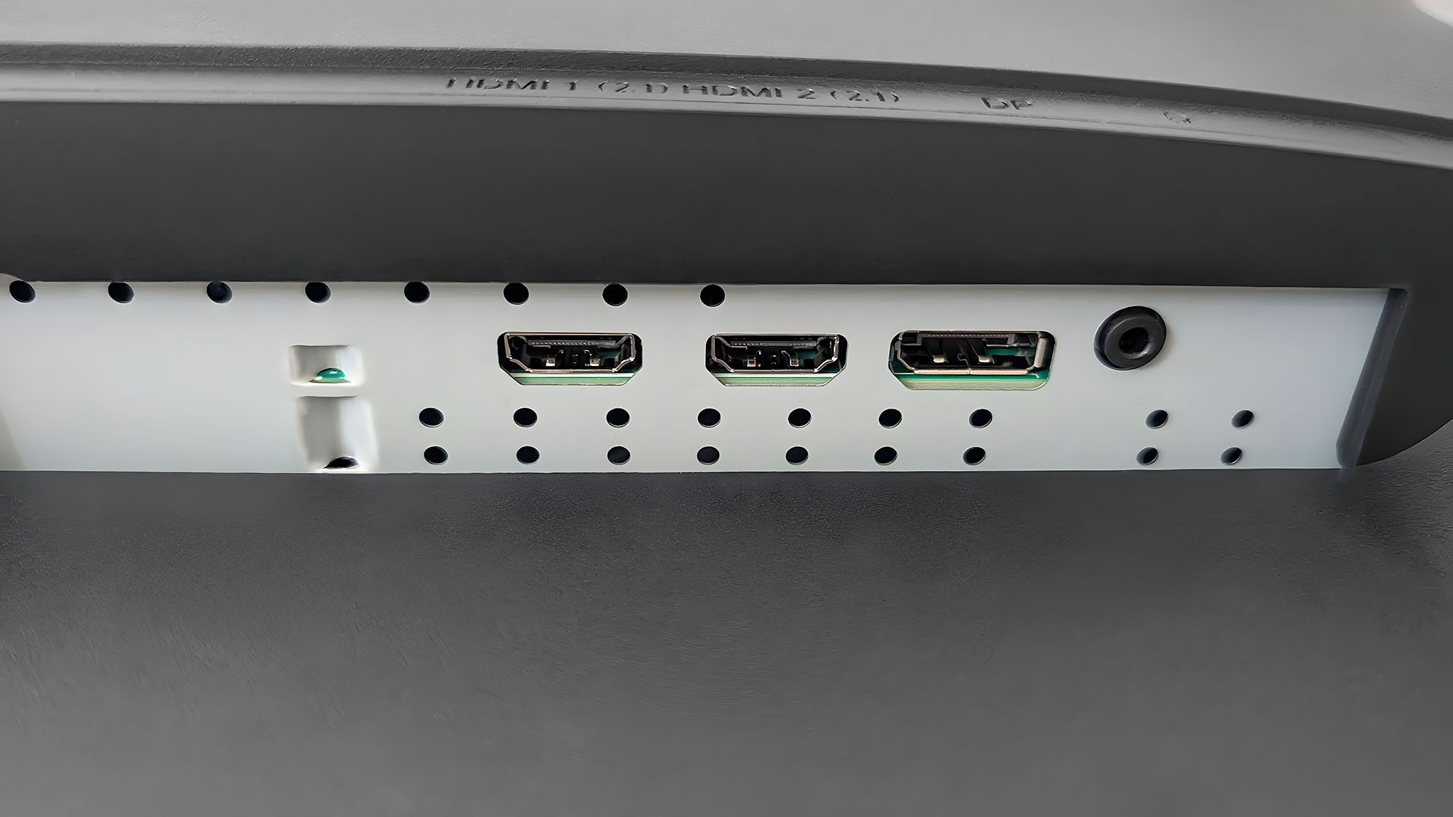 A closeup of the Acer Predator XB273K's two HDMI ports, DisplayPort, and audio jack.