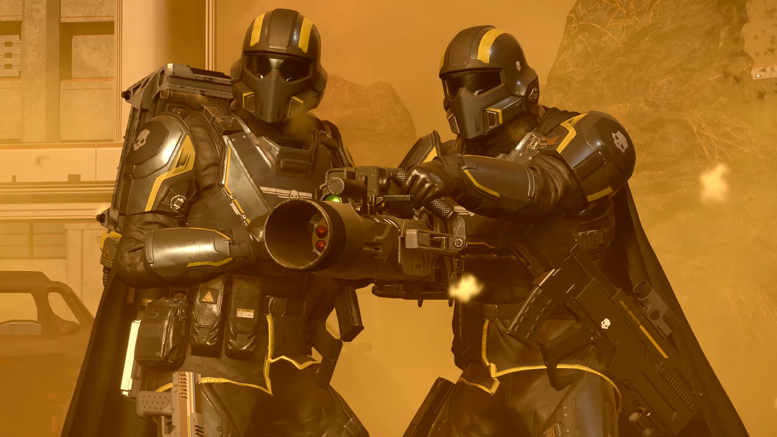 Two Helldivers using a team reload maneuver in battle.