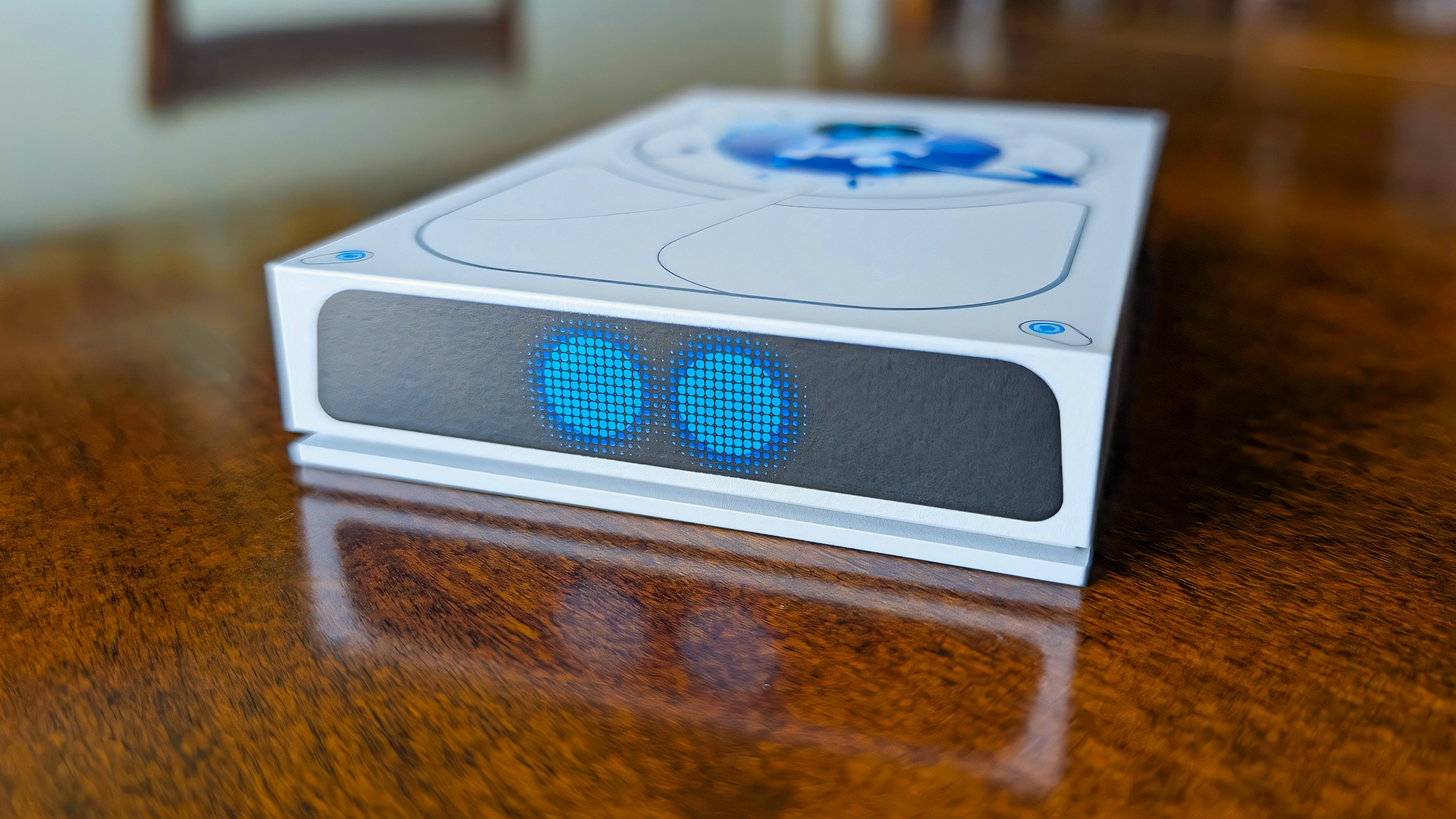 A closeup of the two blue Astro Bot eyes on the bottom of the Seagate Astro Bot Limited Edition Game Drive.