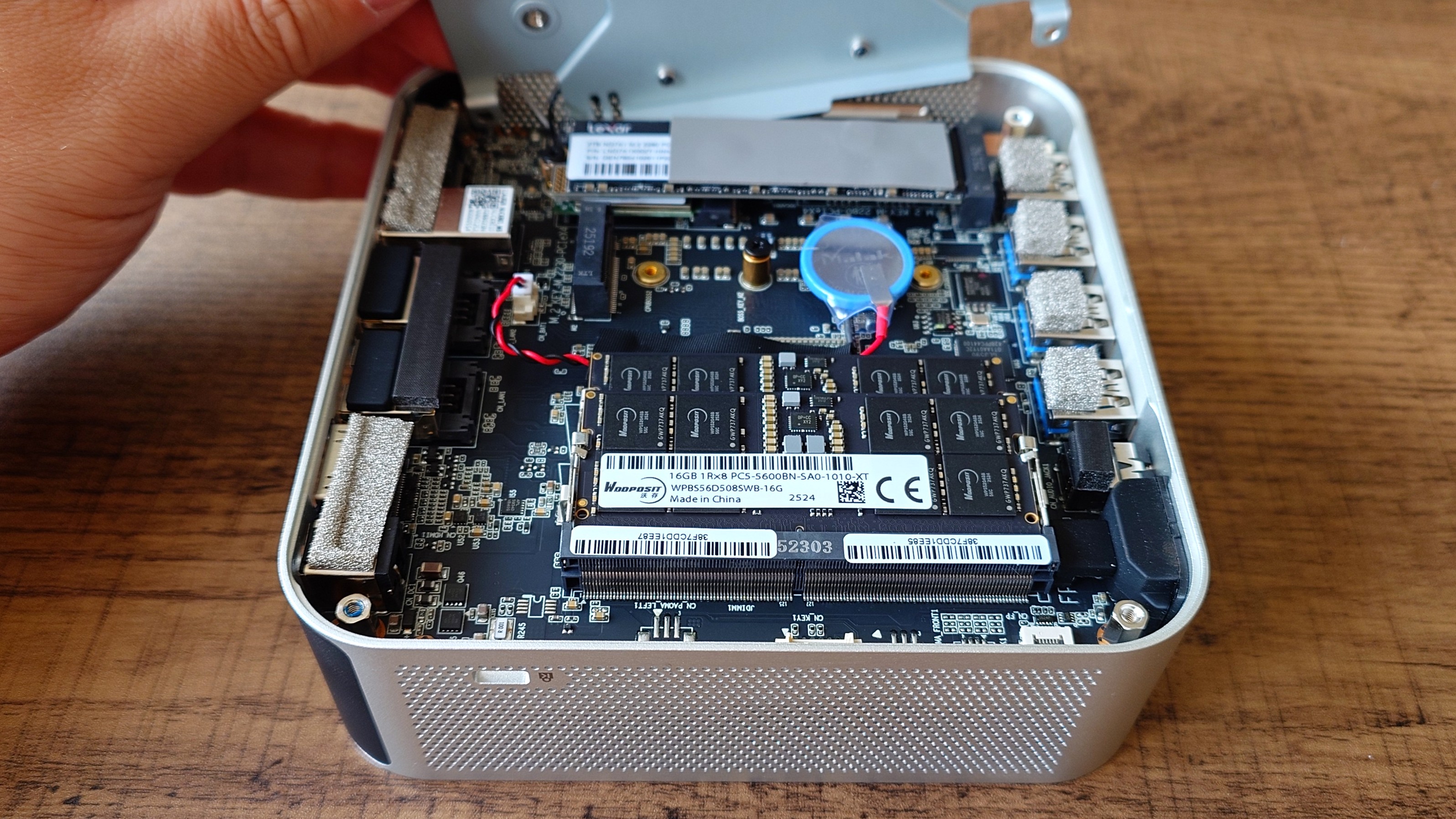 Internals of the Geekom A9 Max mini PC showing upgradeable RAM and a vacant m.2 2230 SSD slot.