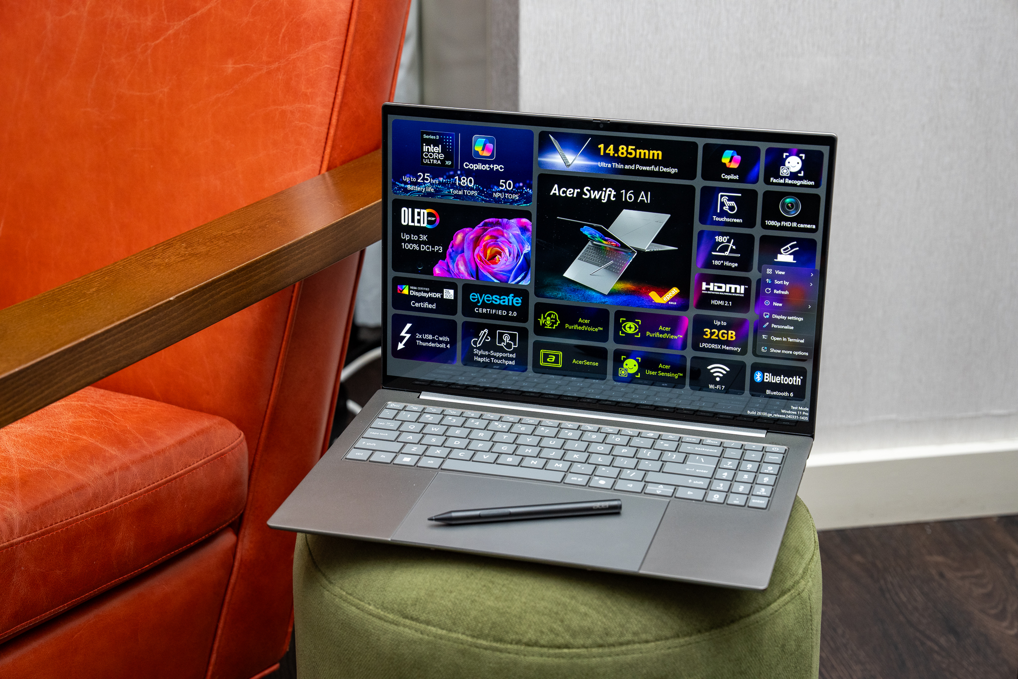 Ноутбук Acer Swift 16 AI, лежащий на оттоманке, со стилусом, покоящимся на его большом трекпаде.