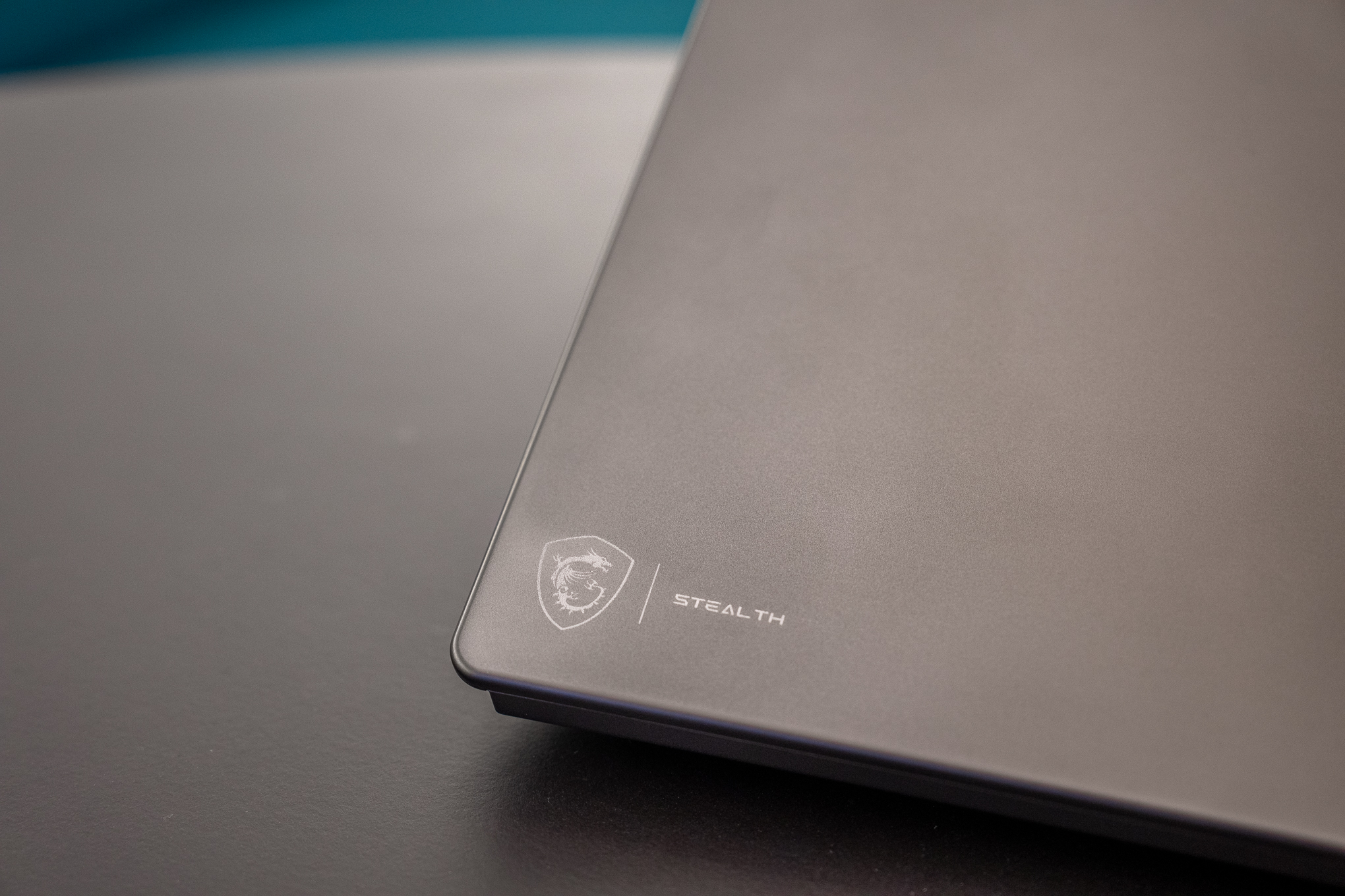 MSI Stealth 16 AI Plus laptop, close-up on the speaker grille and ventilation.