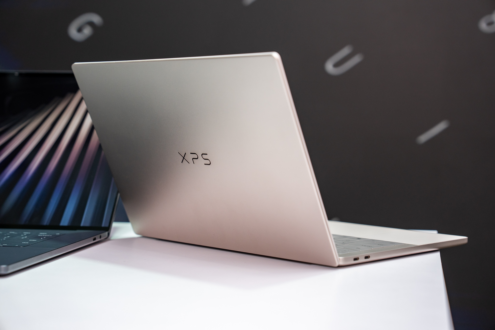 Close-up of the XPS 14 keyboard and trackpad, showing the function row and trackpad etching.