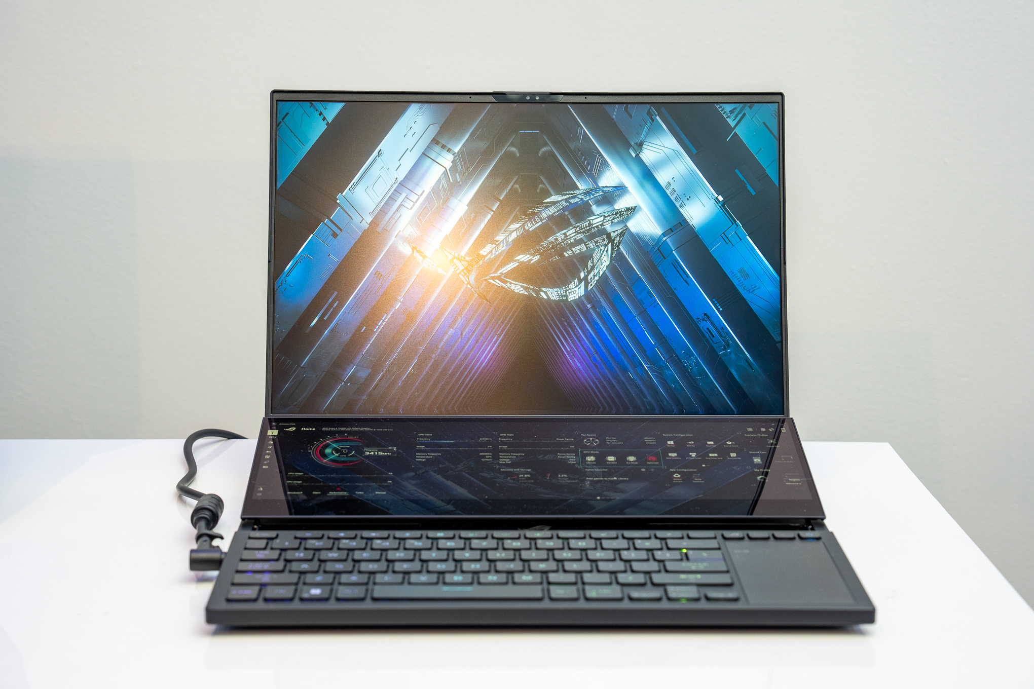 A person using the Asus ROG Zephyrus Duo (2026) with the detachable keyboard in front of the laptop.