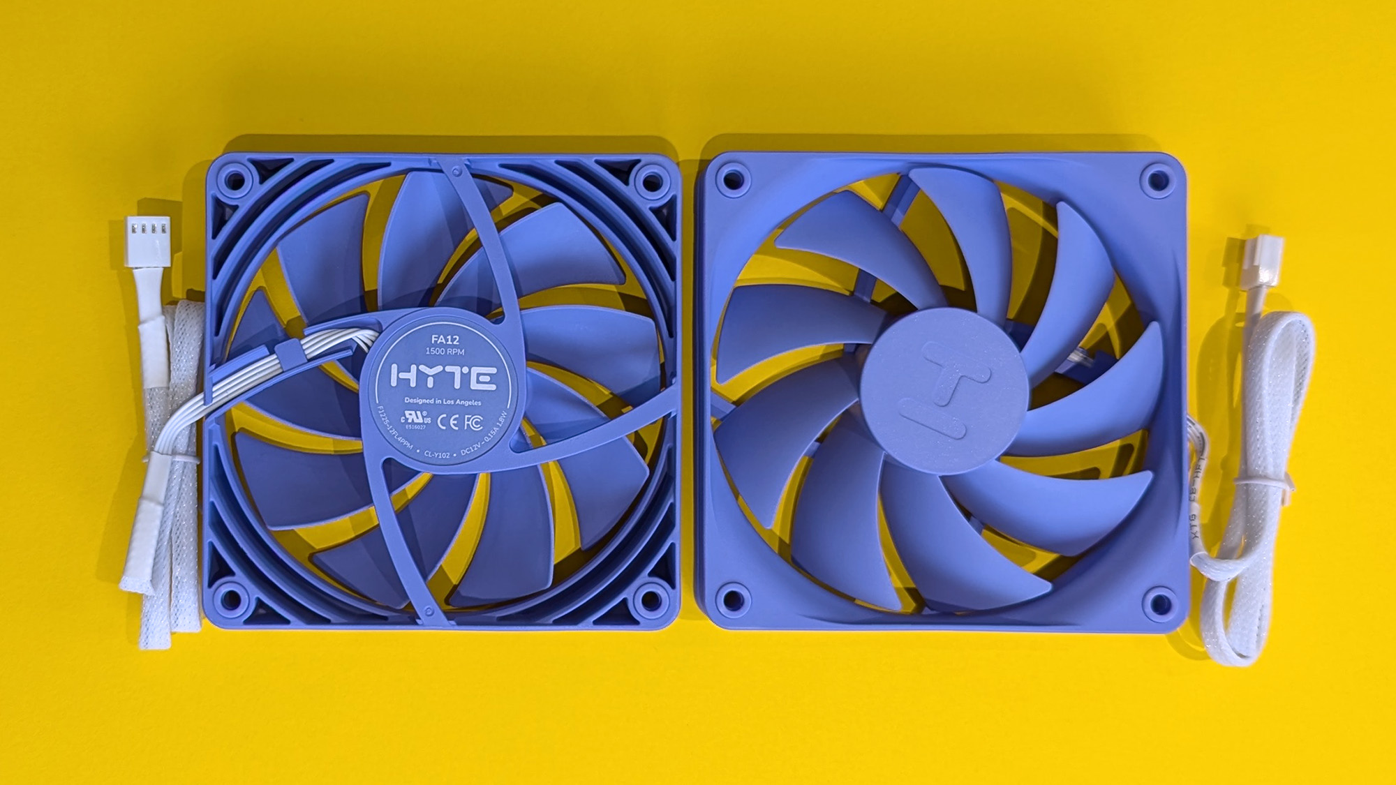 HYTE X50 Taro Milk PC case on a marble desk top, highlighting key features