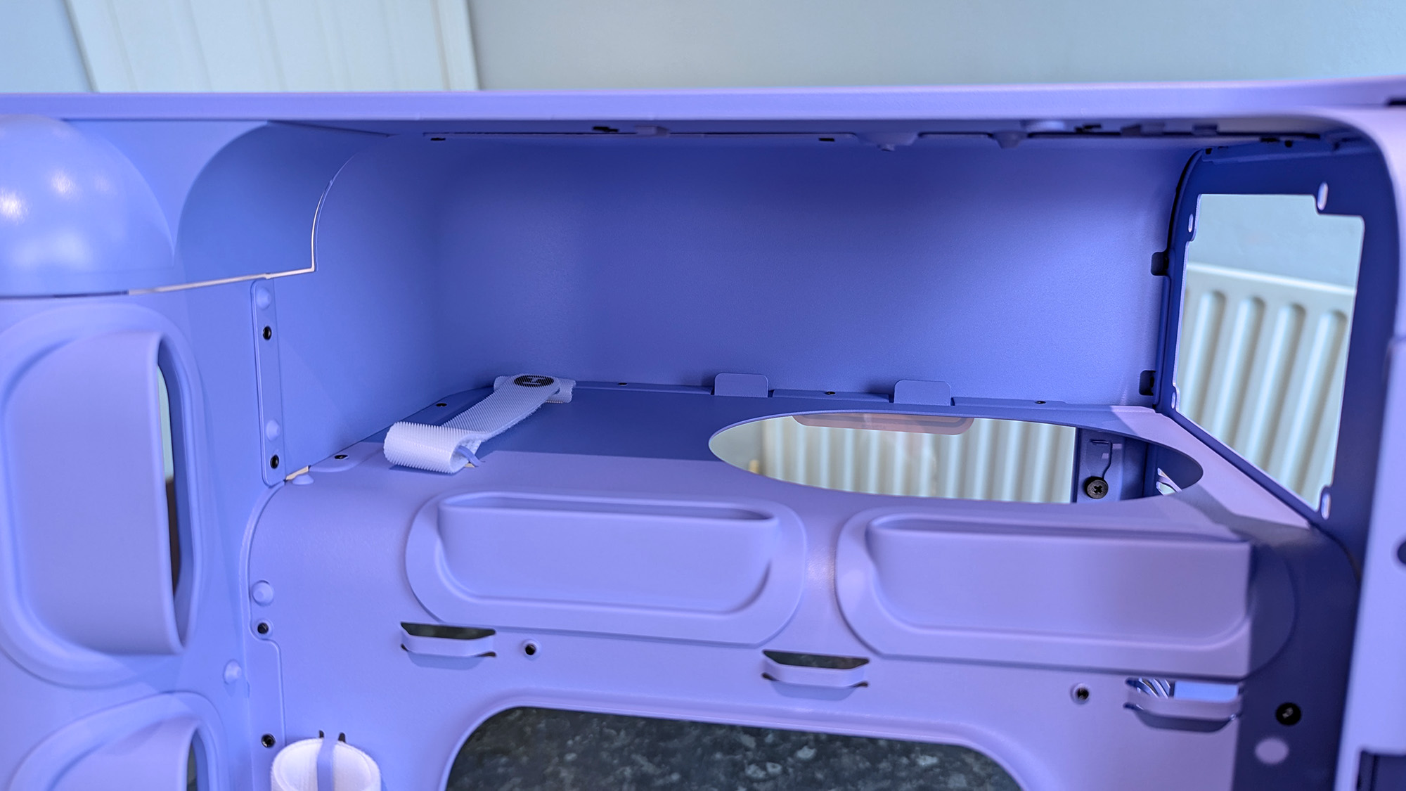 HYTE X50 Taro Milk PC case on a marble desk top, highlighting key features