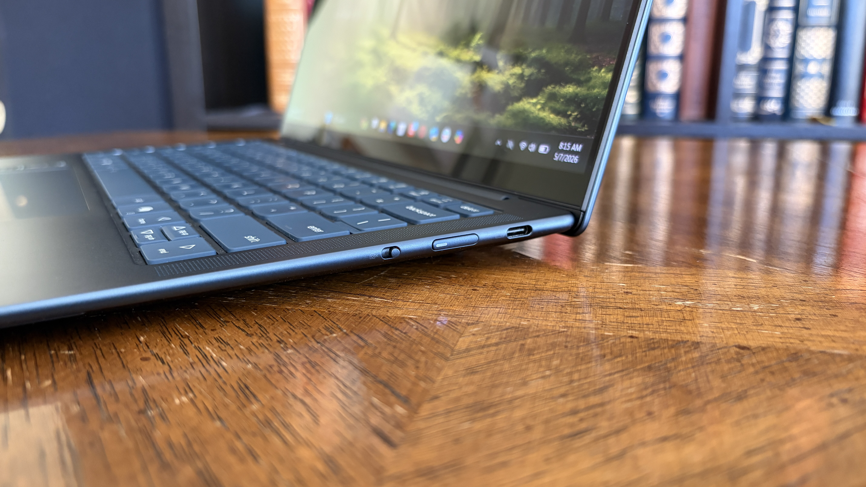 The Yoga Slim 7x (Gen 11)'s right USB4 ports, power button, and e-shutter toggle switch.