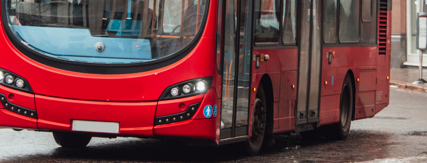 Close up of bus driving along the road
