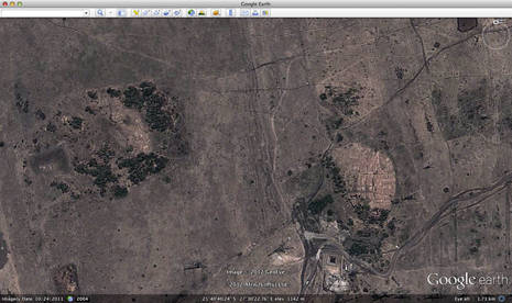 Photo: A satellite view of Wonderkop, the lighter coloured semi-circle to the lower right, and the Small Koppie, which is the more spread out feature to the left. The informal settlement of Nkaneng is to the far right. (Google Earth)