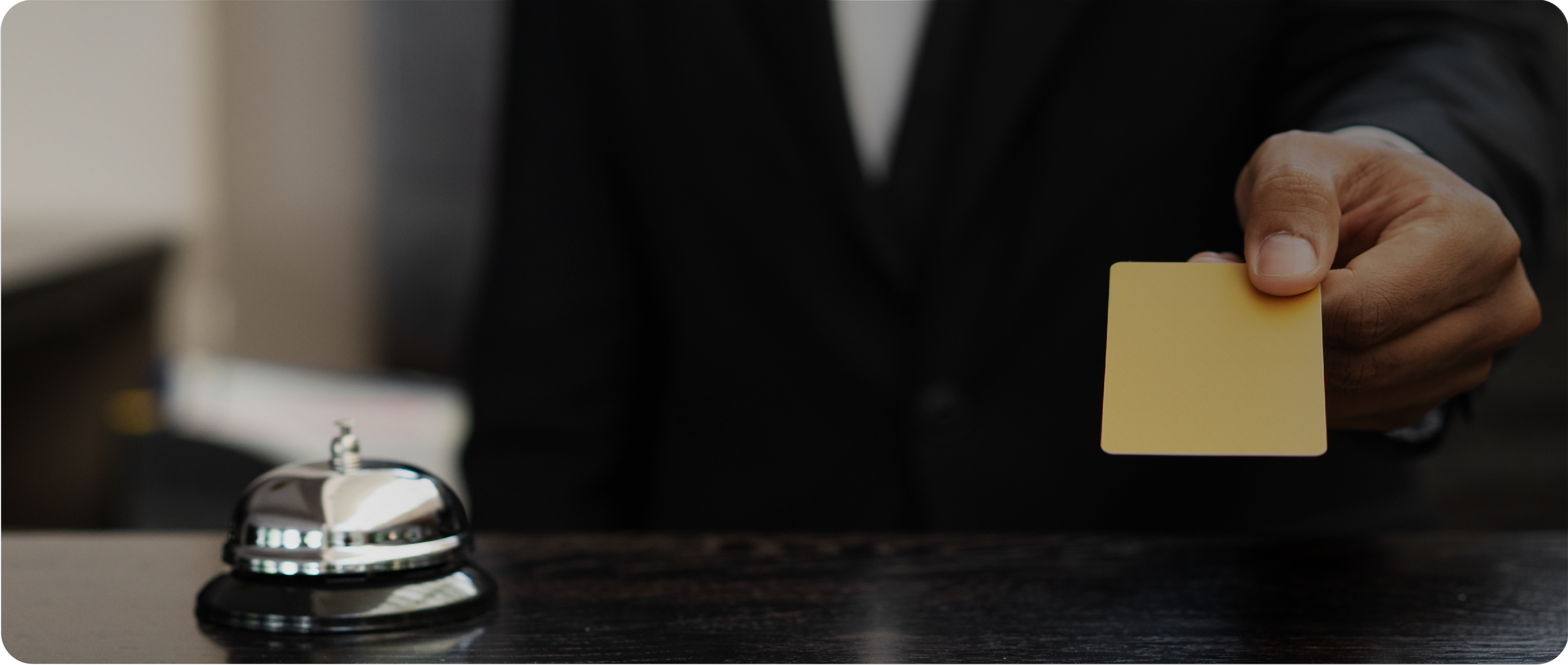 receptionist handing over key card
