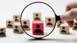 Wooden blocks, magnifying glass on a red block