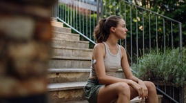 Woman with CGM device on arm