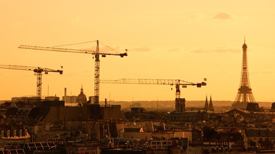 Paris skyline with cranes and Eiffel Tower