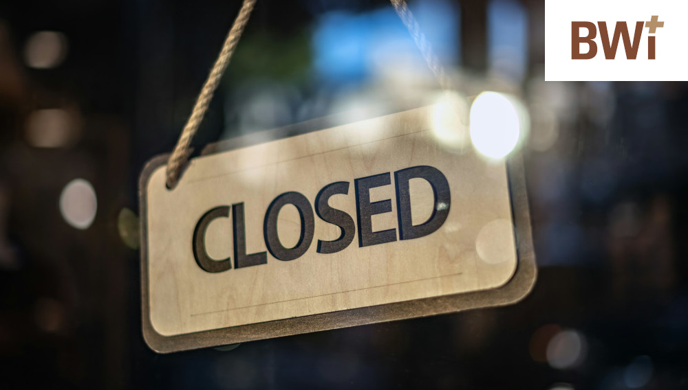 A closed sign made from wood (Photo: Tim Mossholder on Unsplash)