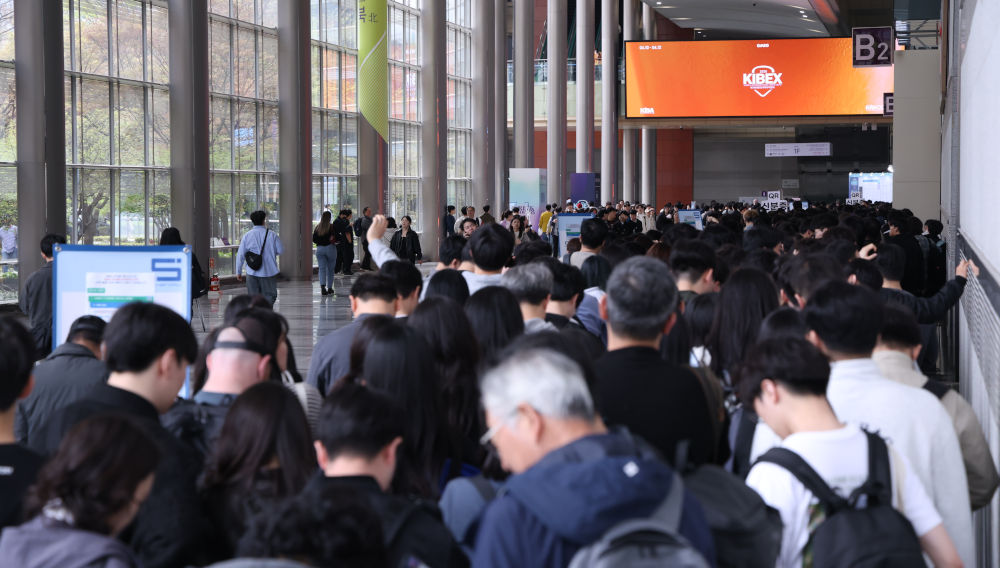 Visitors to one of the previous Kibex editions in a hallway of the trade fair centre