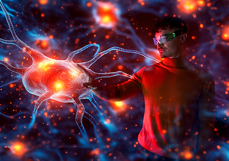 Junger Mann interagiert mit einem holografischen Neuron in erweiterter Realität