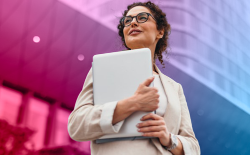 Woman walking with papers