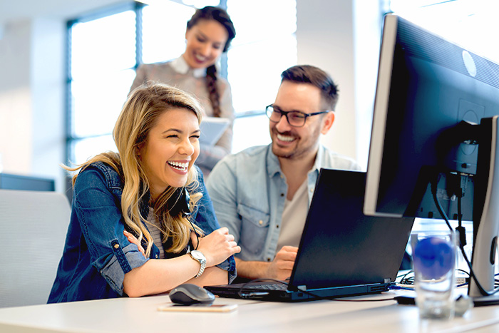 Group of business people and software developers working as a team in office