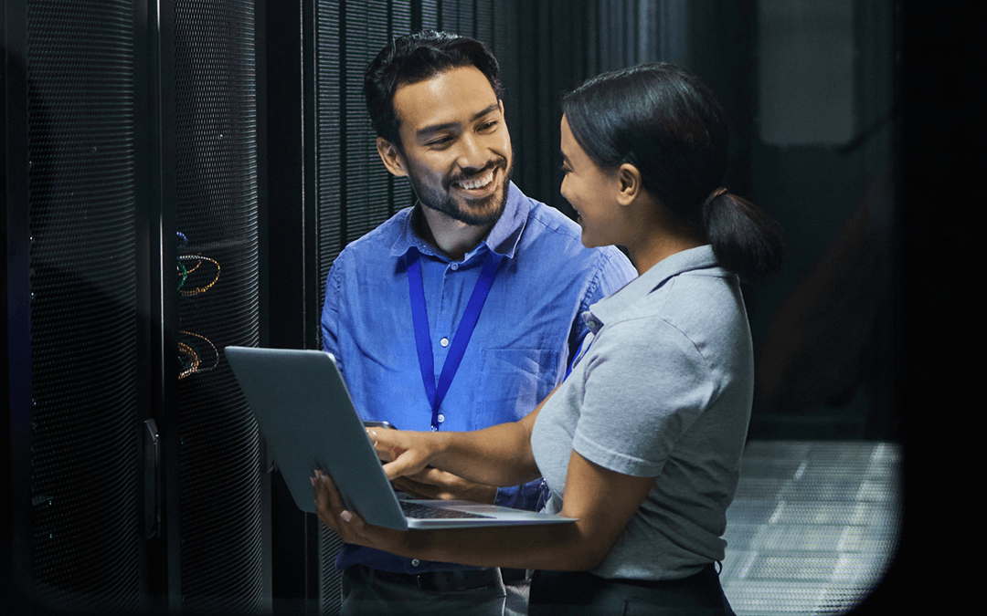 Man woman or laptop in server room it engineering or software programming for cybersecurity analytics or database safety smile happy or data center people on technology in teamwork collaboration