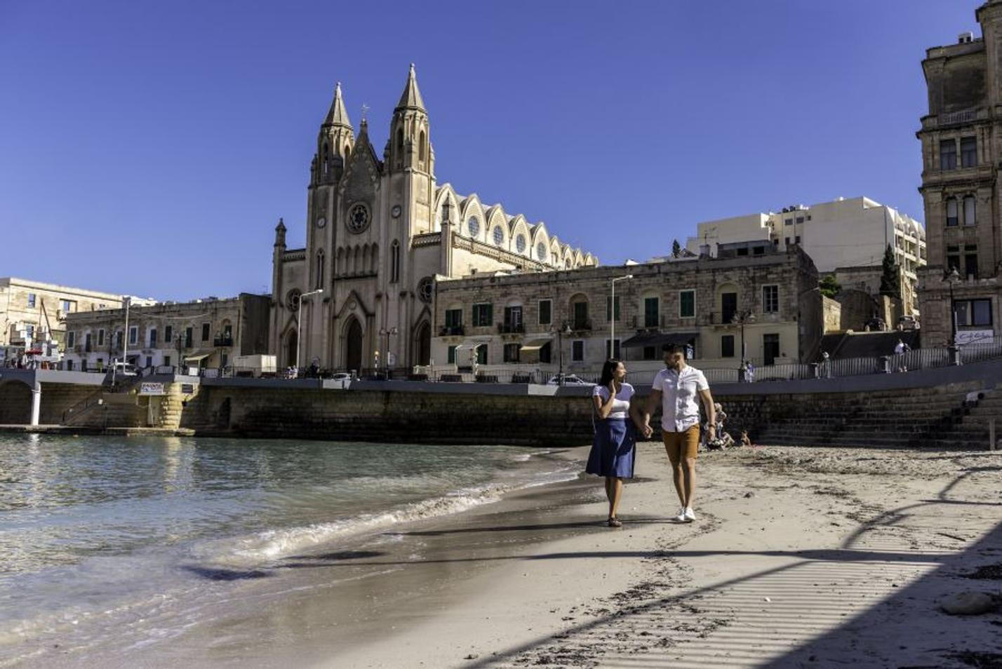 Enjoying the sandy beach of Balluta Bay in Malta