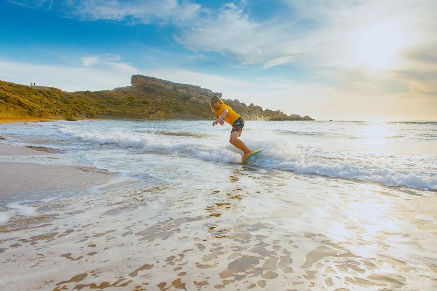 Surfing in Malta at the Golden Bay Beach