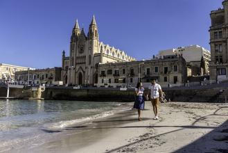 Enjoying the sandy beach of Balluta Bay in Malta