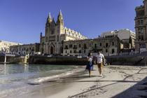 Enjoying the sandy beach of Balluta Bay in Malta