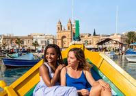 Enjoying the sun in a Luzzu boat