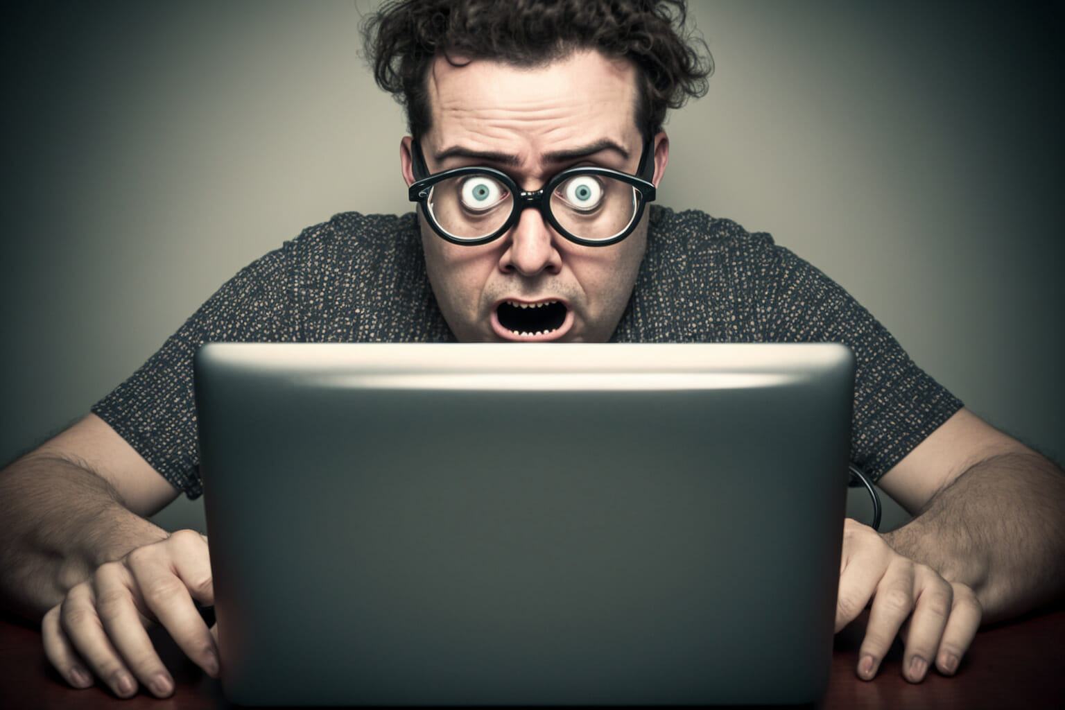 (AI) man stares at his laptop