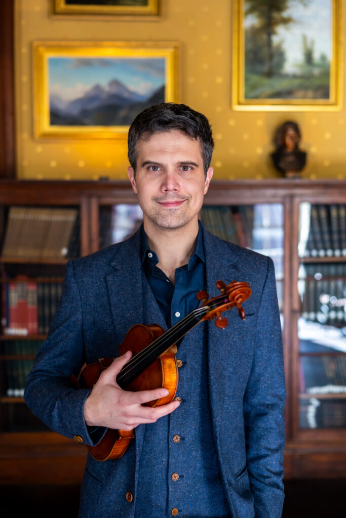 Nathan Gourley holding fiddle